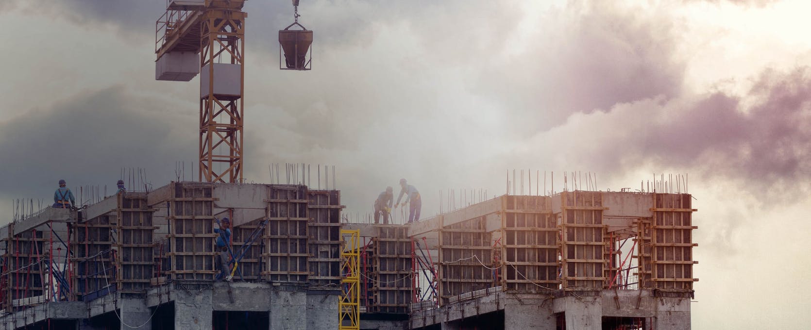 Construction workers active on a project development building job site