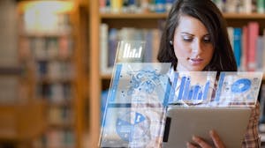 Woman looking at data visualization on tablet