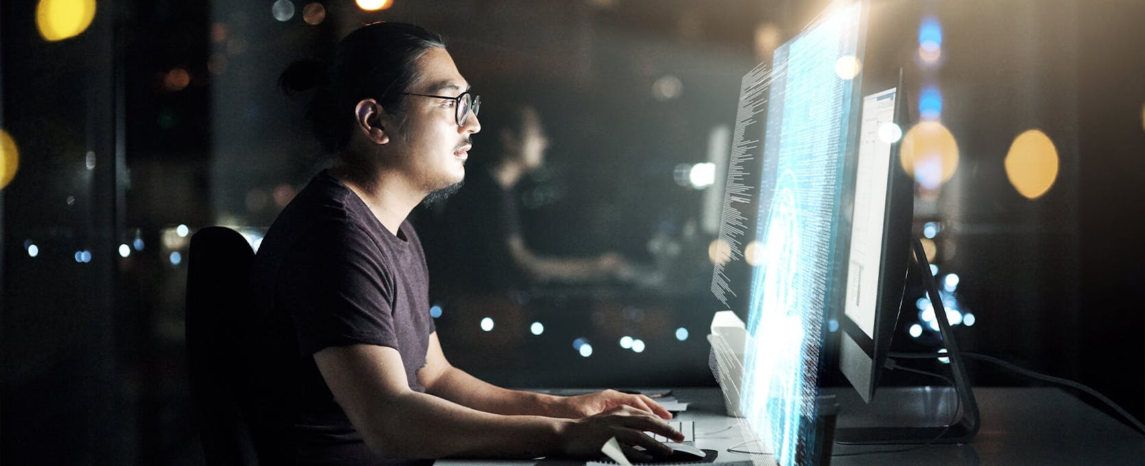 Cybersecurity professionals performs a risk assessment at a computer