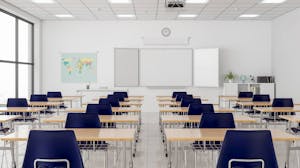 Empty desks in modern school classroom