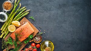 Fresh food board with salmon and vegetables