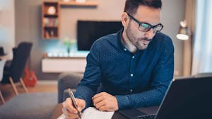 Man working at a computer from home