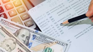 Finance executive analyzes cash on hand report