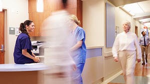 Hospital Hallway with Doctors, Staff & Patients walking by