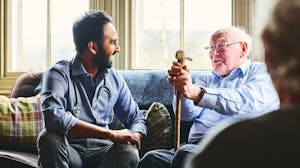 Practitioner at a senior living center meets with client