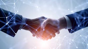 Businessmen close deal with handshake