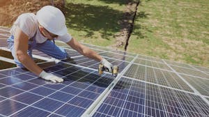 contractor installing solar panel