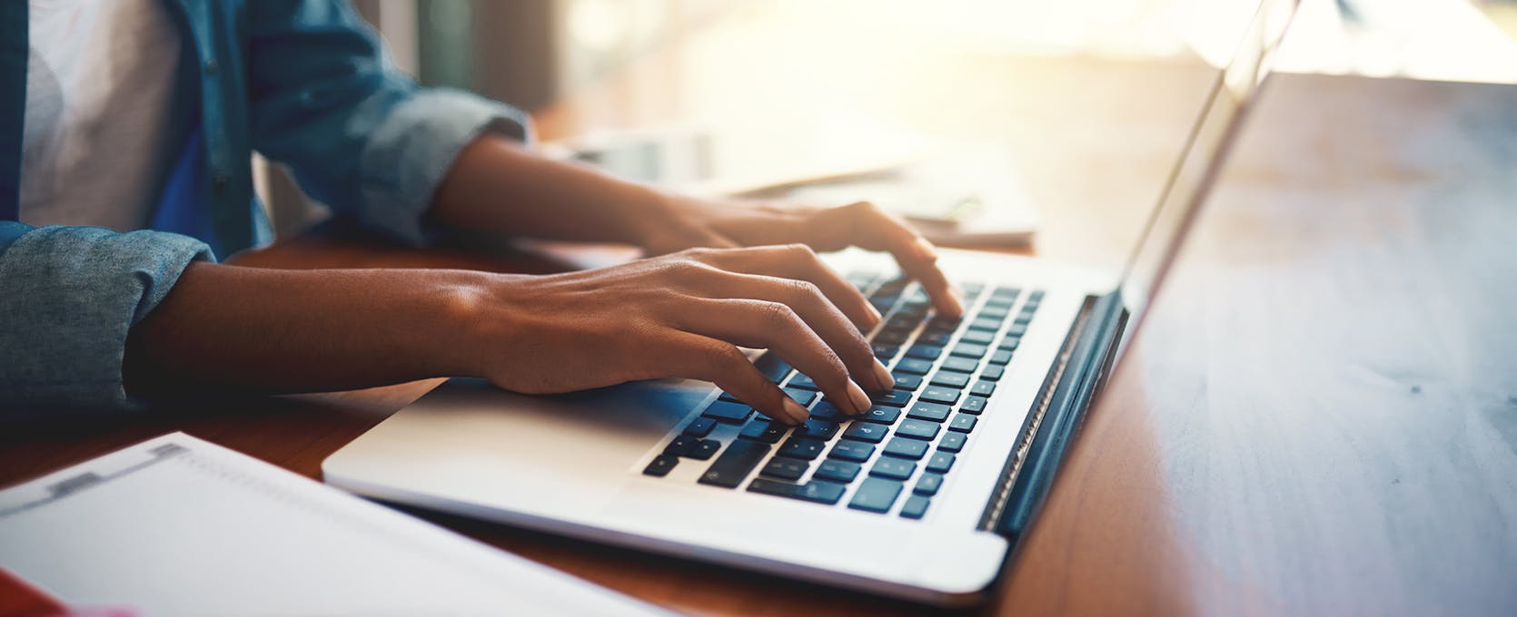 Person typing on a laptop