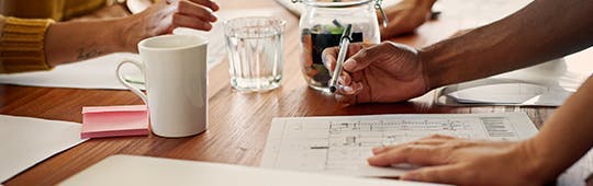 A person sitting at a desk, focused on working on a project