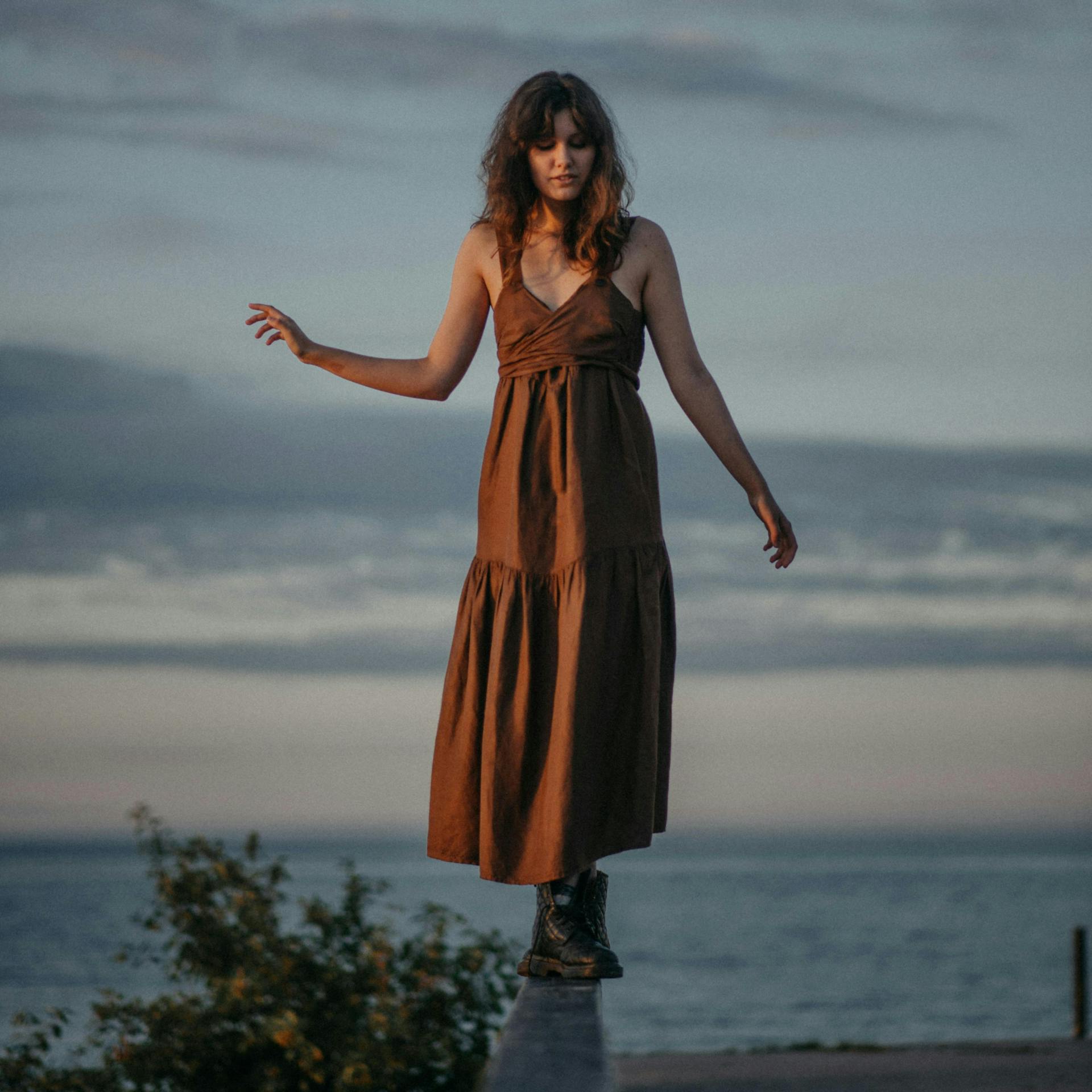 Woman balancing on a beam
