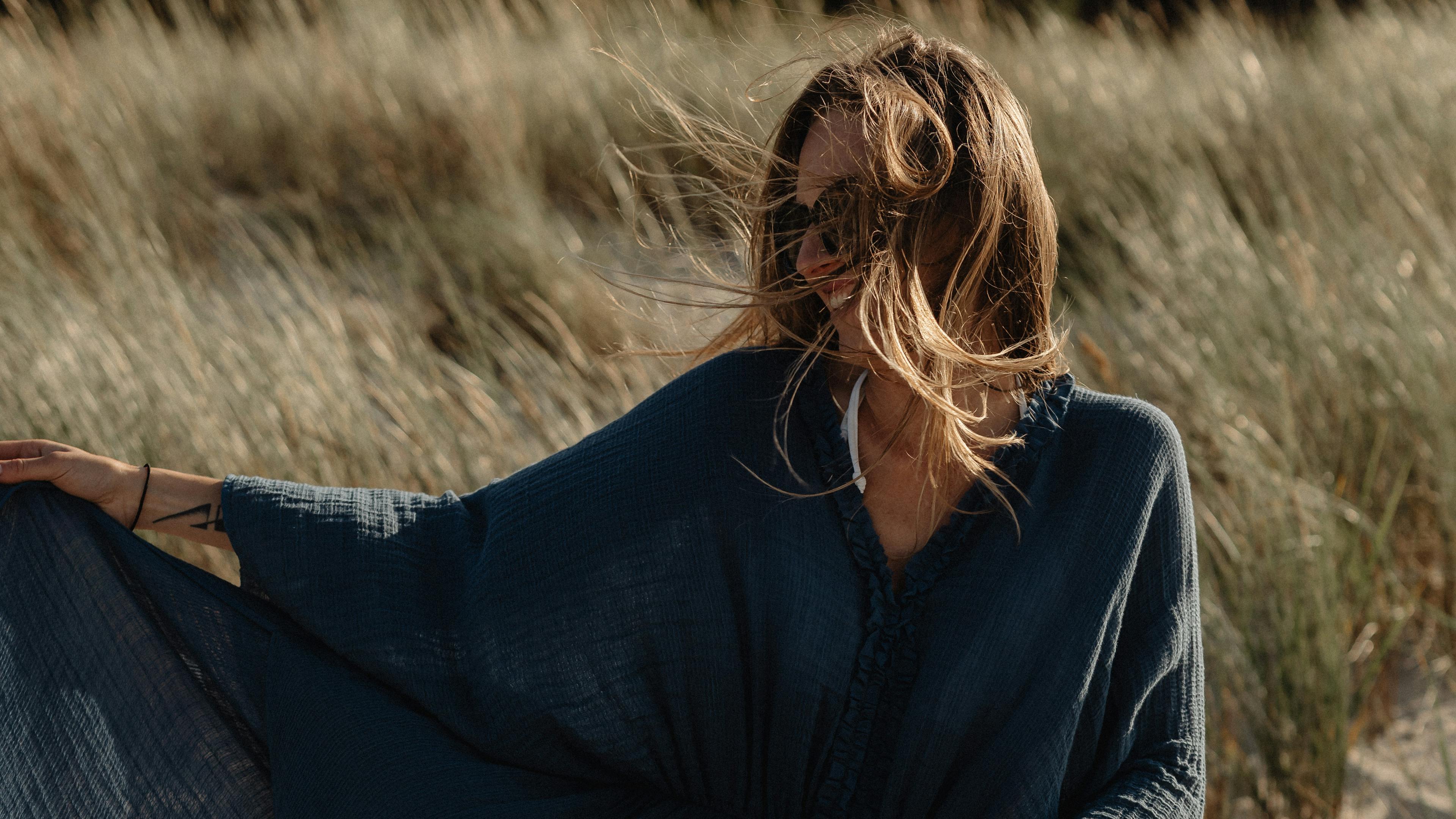 Woman at the beach at sunset