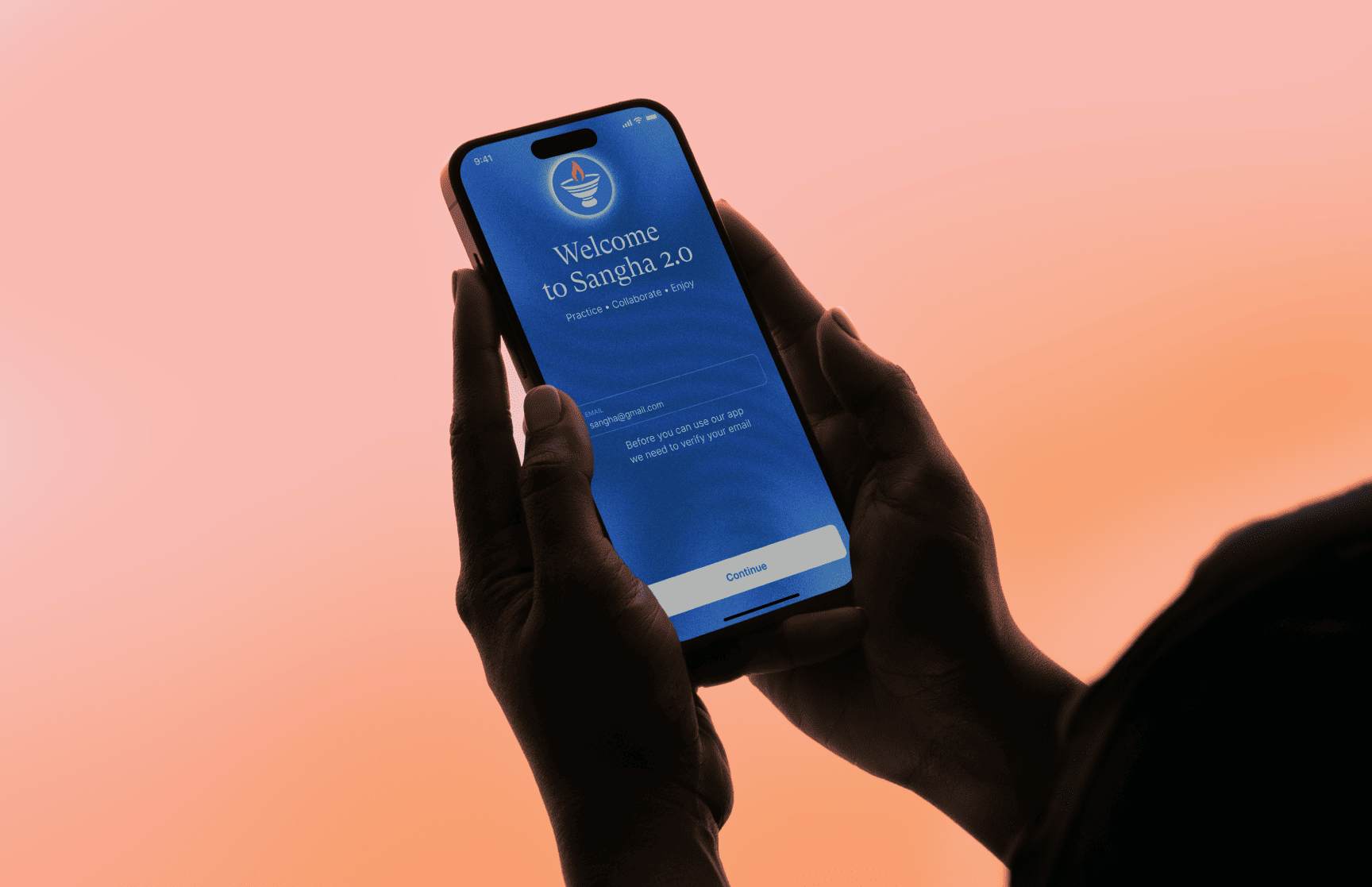 Sangha app splash screen on phone in hands