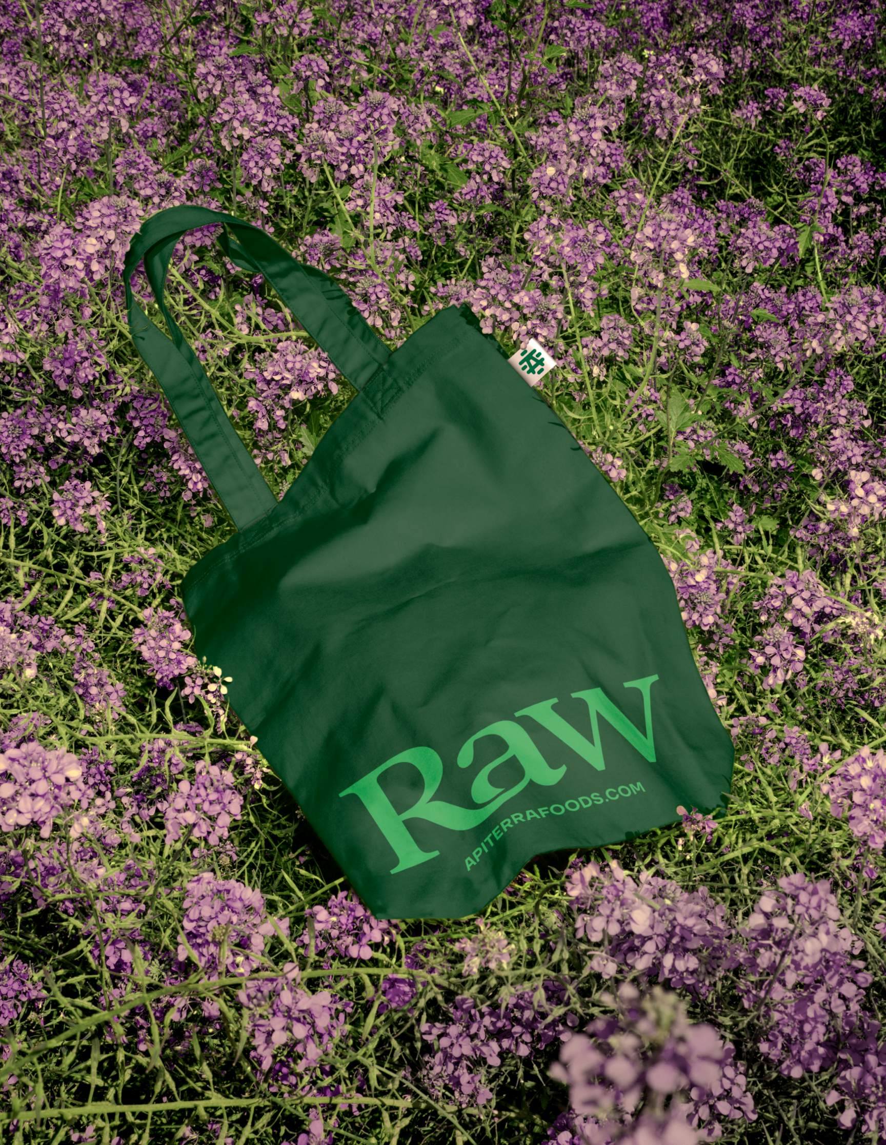 green tote bag on purple flower background