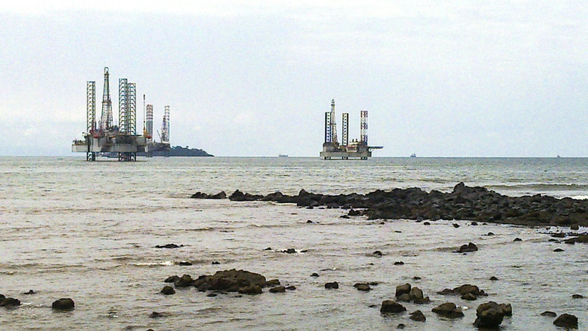 Picture showing two oil rigs.