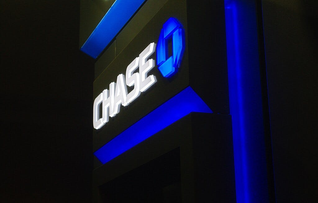 Chase Bank logo glowing ominously against a black background