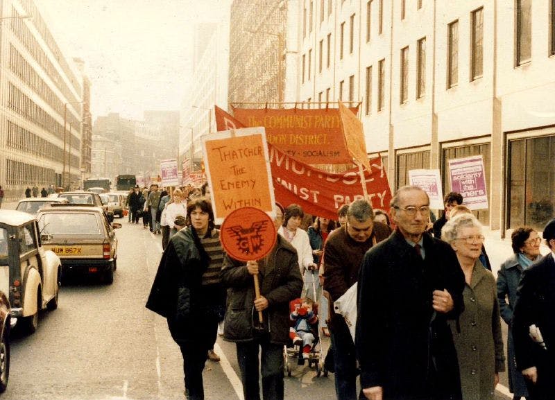 Miner's Strike Rally, 1984, London. Strikers march along a London street holding pro-miner, anti-Thatcher signs