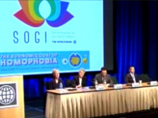A panel presenting to an audience