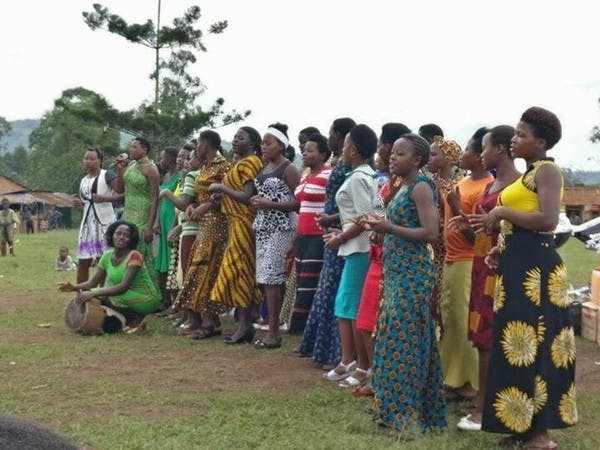 Women sing and clap in a group