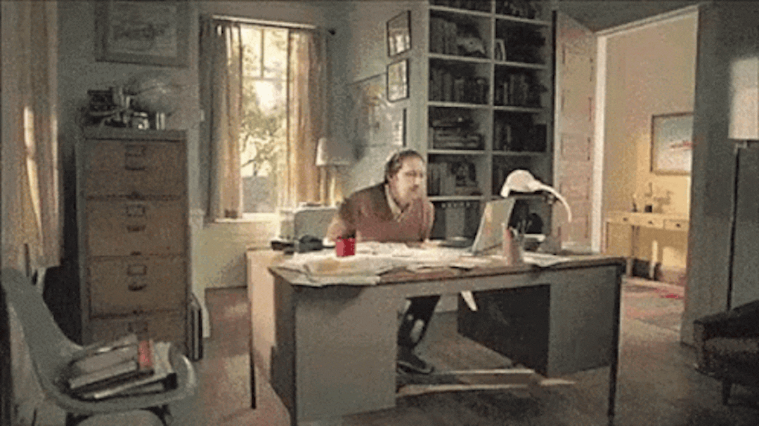 GIF of a messy desk being flipped to a clean one