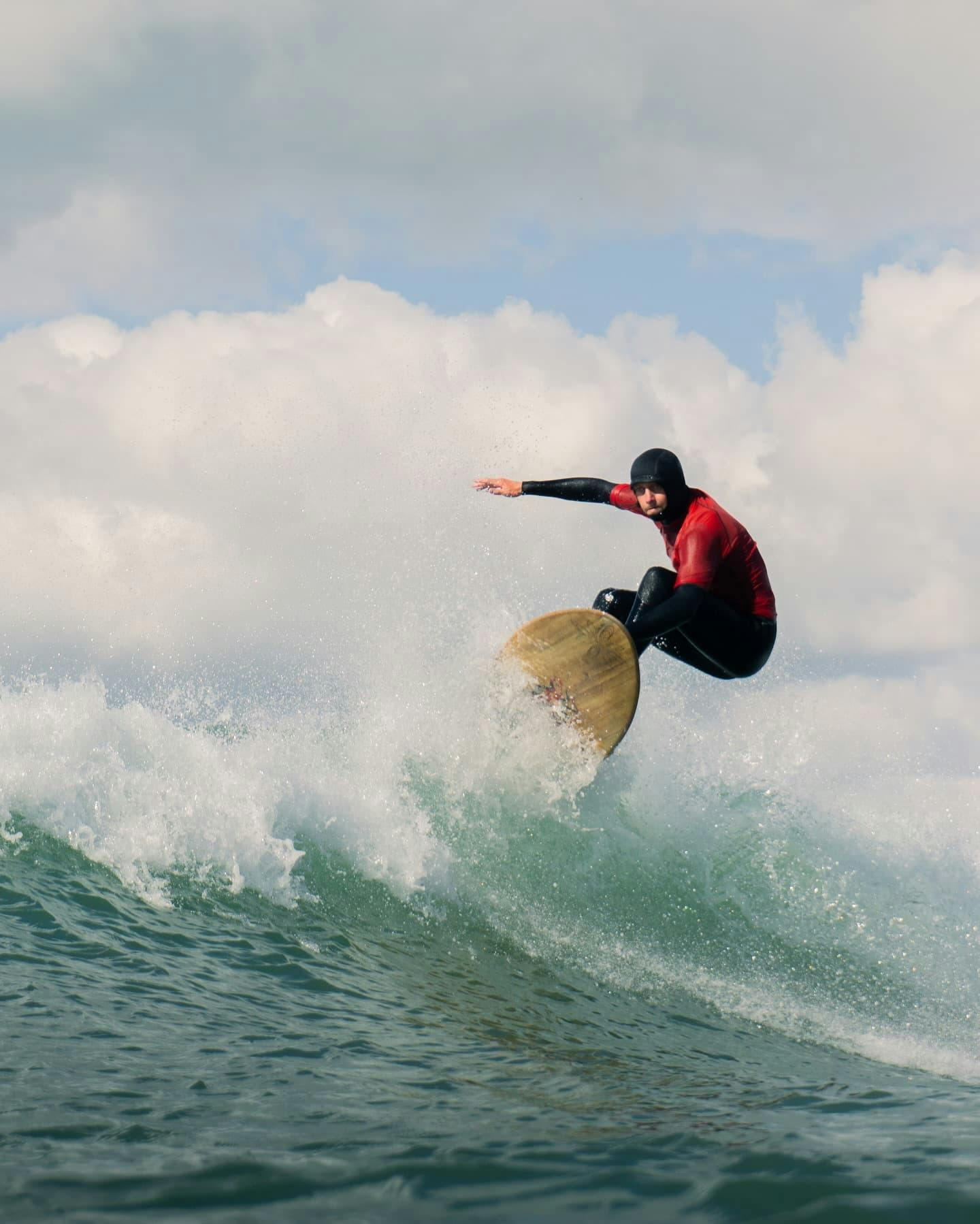 Surfer popping over the wave