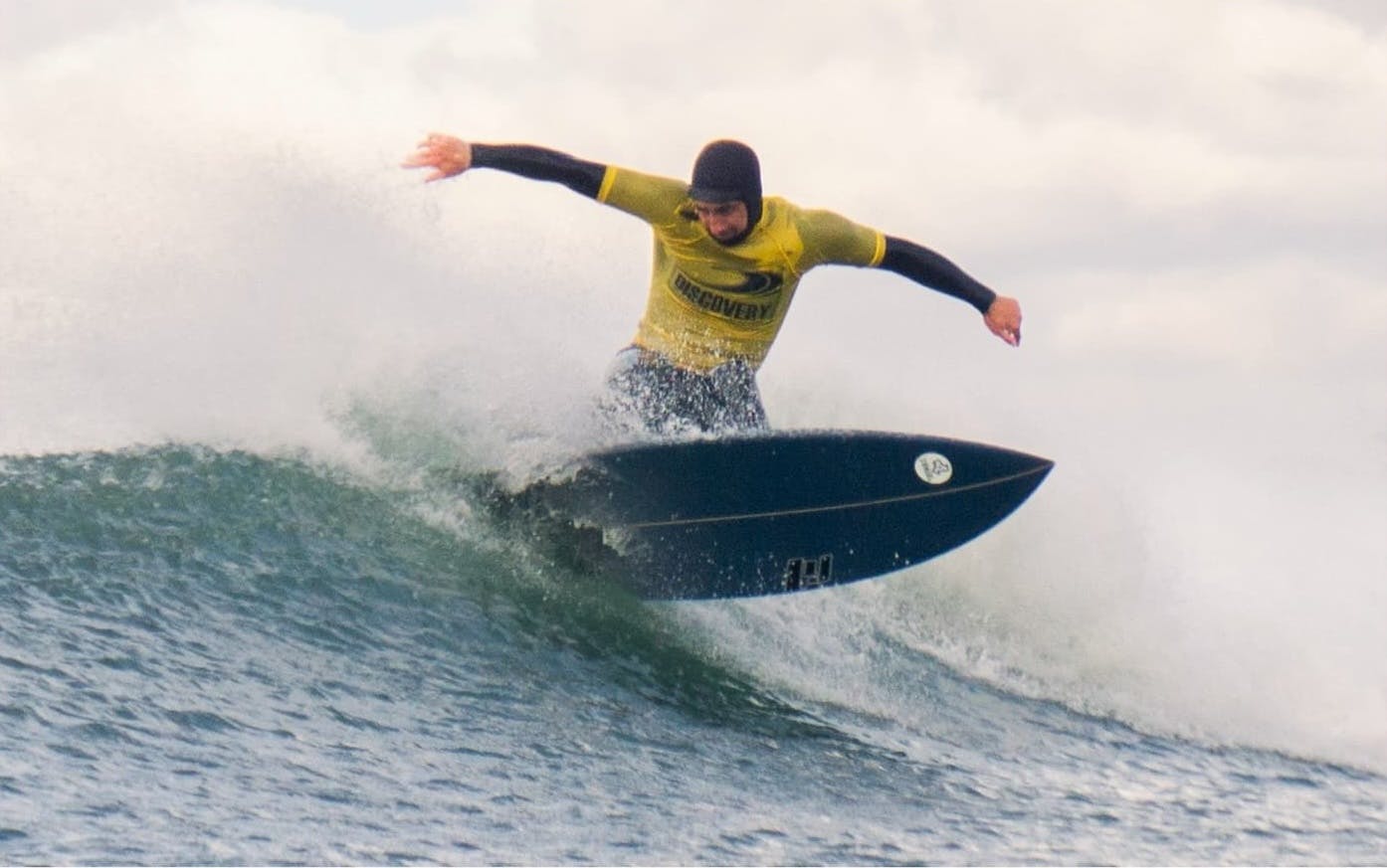 Bantham surfer in a yellow outfit