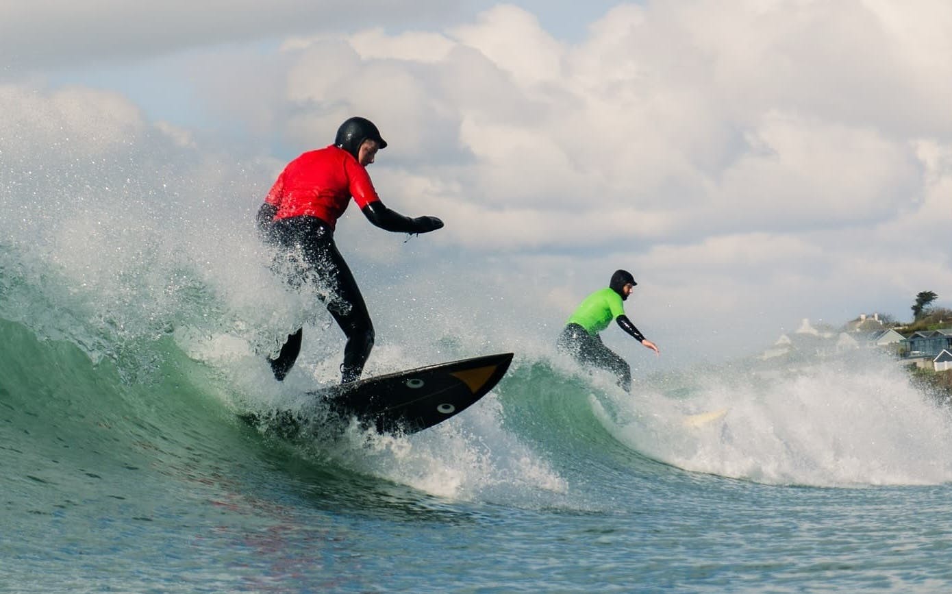 Two surfders on the same wave at Bantham