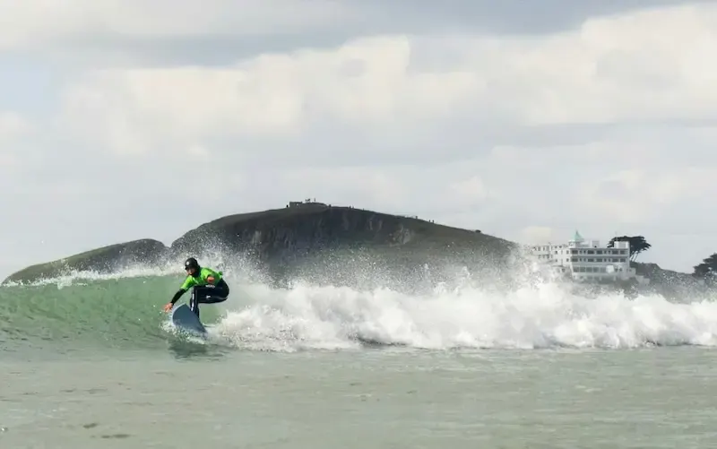 Surfer with Burgh Island in the background