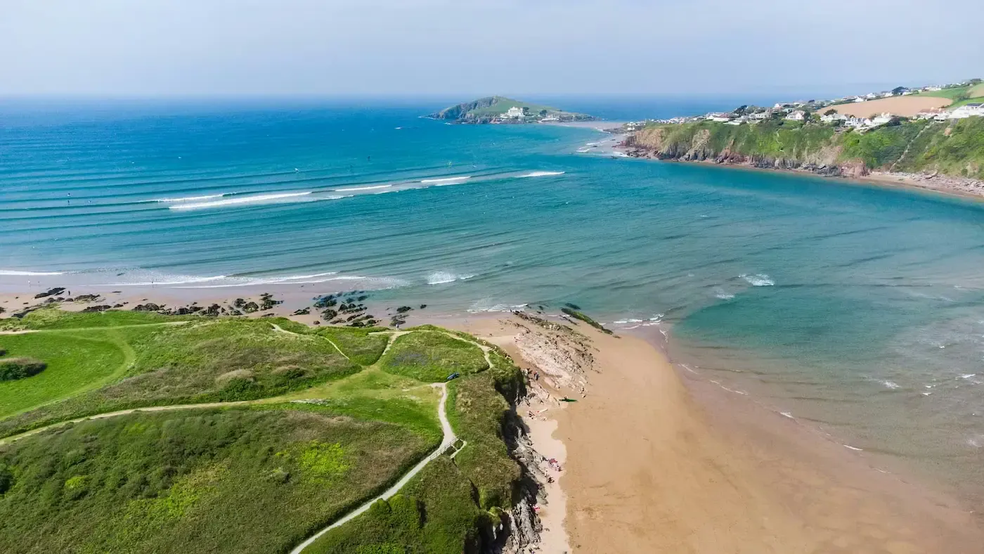 A drone shot of Bantham beach and waters looking out to Burgh Island