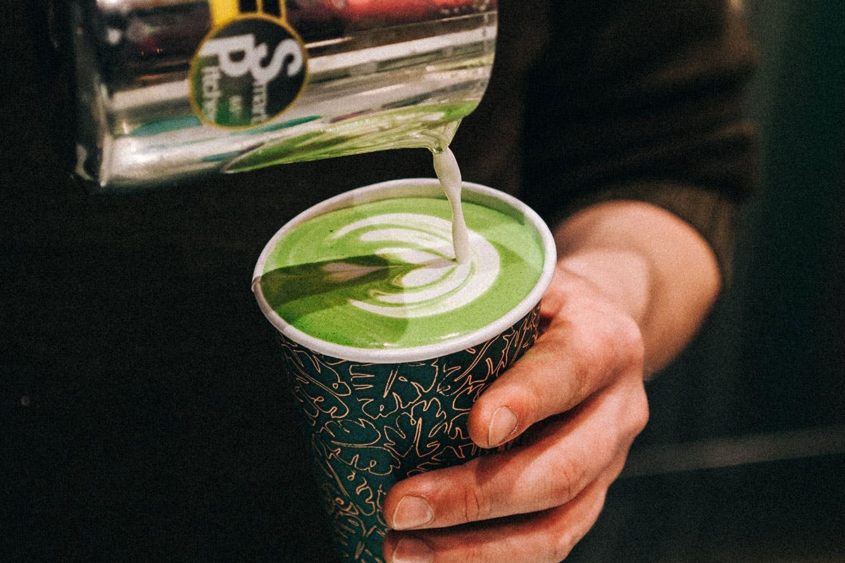 Matcha latte being poured