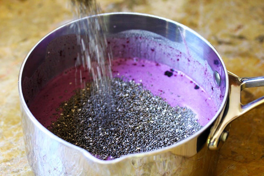 chia seeds pouring into smoothie