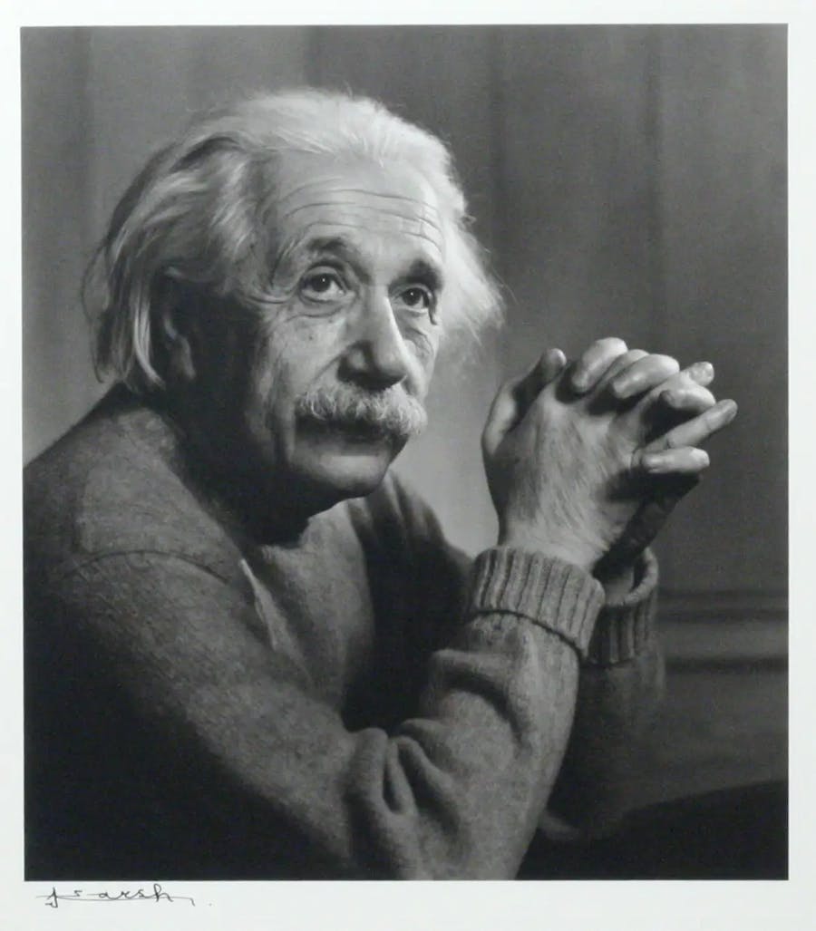 Portrait Photograph of Albert Einstein, signed by Yousuf Karsh. Silver print. Photo taken Princeton, 1948. Printed later. Signed by Karsh in full beneath the image on photographer’s mount. With Karsh’s original calling “card” – a 4x10 inch cardboard slip – included. Image: 8x9 inches. Framed to an overall size of 12x15 inches. Image © Manhattan Rare Books
