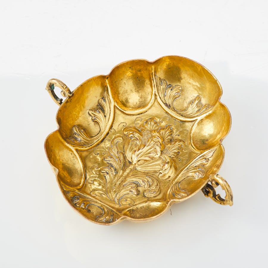 A baroque Herrengrund late 17th/early 18th century embossed gilt copper cup with inscription.