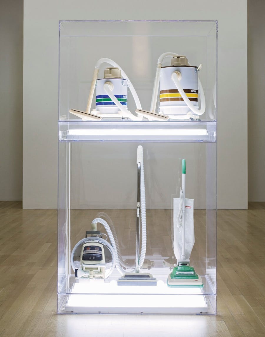 Jeff Koons, ‘NEW HOOVER CELEBRITY IV, NEW HOOVER CONVERTIBLE, NEW SHELTON 5 GALLON WET/DRY, NEW SHELTON 10 GALLON WET/DRY DOUBLEDECKER’,  1981-86, four vacuum cleaners, acrylic, fluorescent lights. Photo © Sotheby’s
