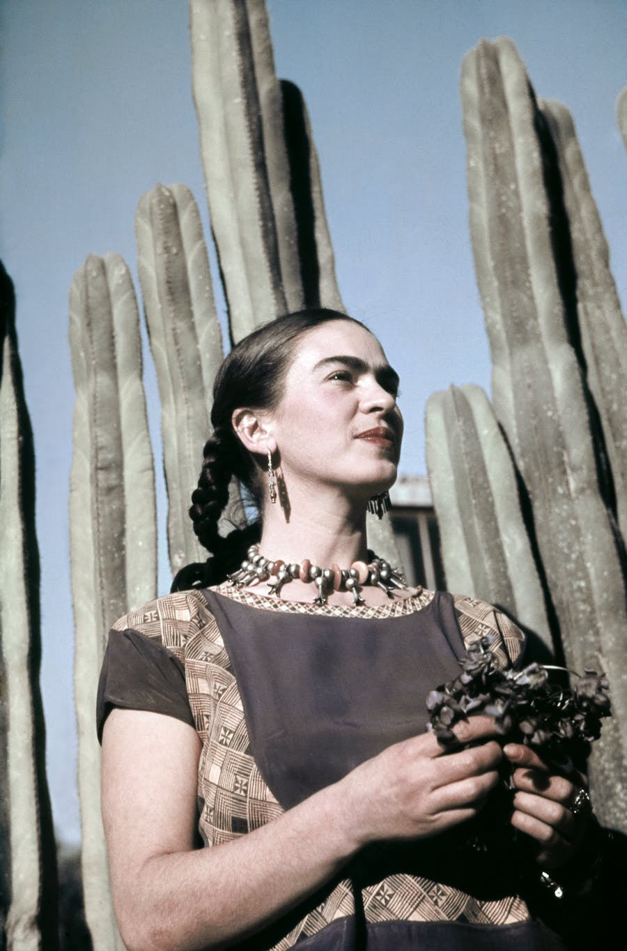 The artist Frida Kahlo at her home, designed by architect Juan O'Gorman c. 1940 in Colonia San Angel, Mexico City, Mexico. Photo: Ivan Dmitri / Michael Ochs Archives / Getty Images