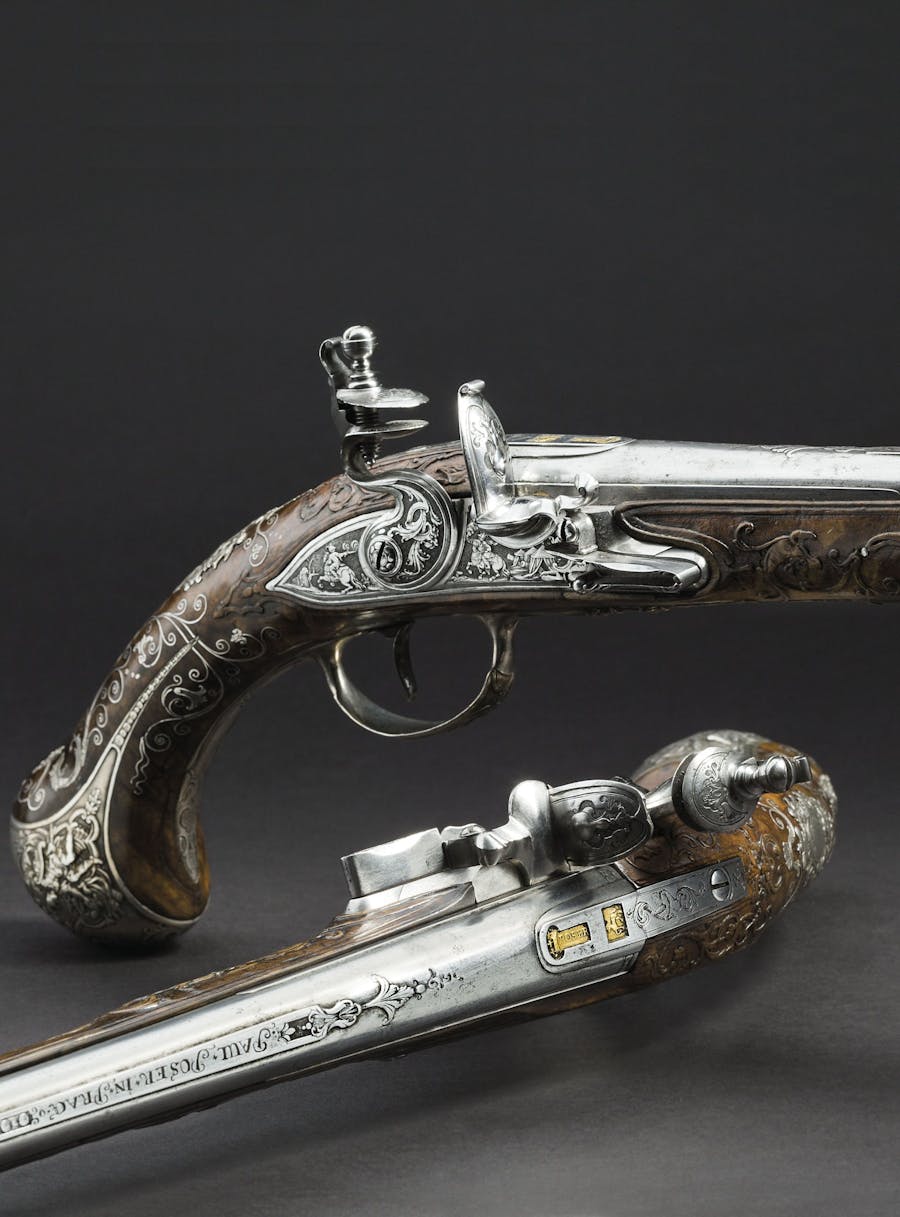 A pair of significant de luxe flintlock pistols from the armory of the Princes von Lobkowitz, Paul Ignazius Poser and Franz Matzenkopf, Prague, circa 1730 