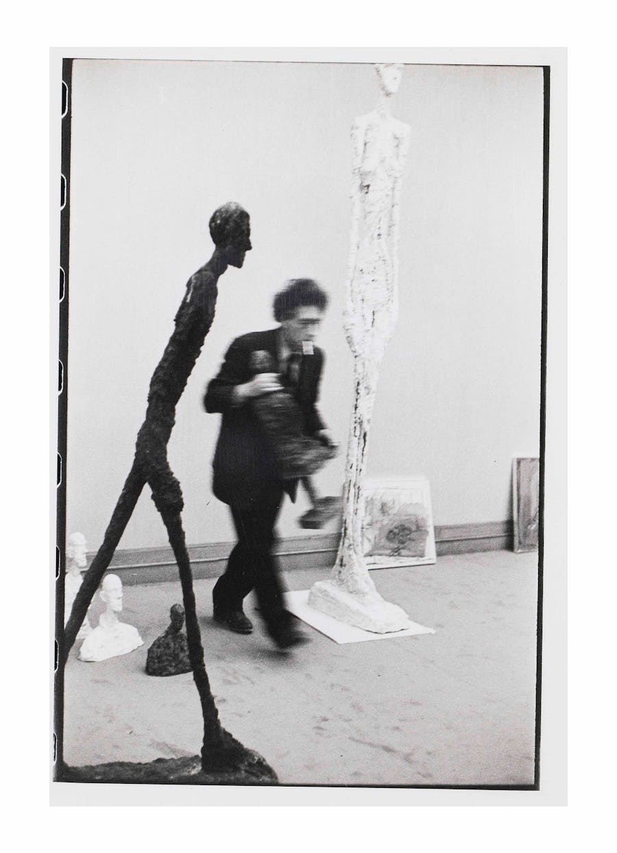Henri Cartier-Bresson (1908-2004), Alberto Giacometti with Walking Man at Gallery Maeght, 1961, 1961, ferrotyped gelatin silver print, 26 x 17.7 cm. Image via Christie’s.
