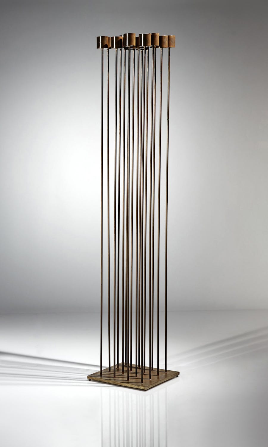Harry Bertoia, Untitled (Sonambient), circa 1970s, four rows of four rods (16 rods total) with cylinder tops on applied feet, bronze, beryllium copper and brass. Image © Sotheby's