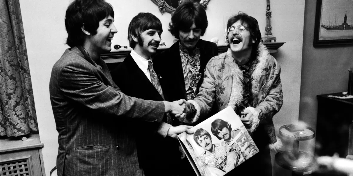 The Beatles with a copy of Sgt. Pepper's Lonely Hearts Club Band in 1967. Image © John Downing/Getty Images (detail)