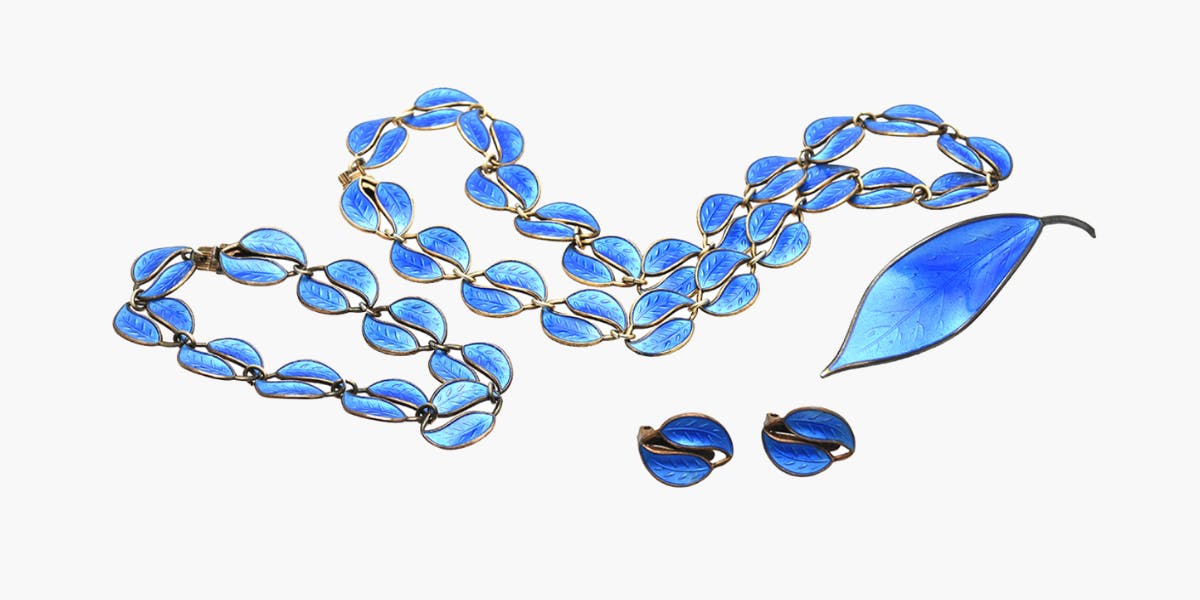 David Andersen blue enamel and sterling silver jewellery set, necklace, bracelet, brooch, and earrings. Photo © Kaplans Auktioner