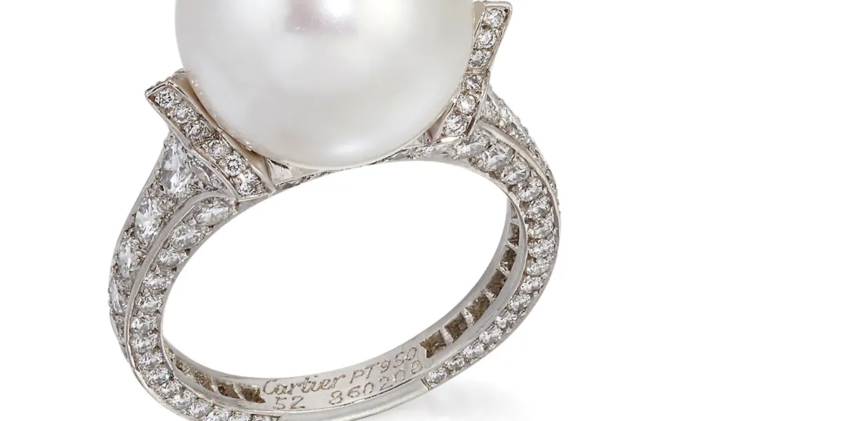 Cartier, A cultured pearl and diamond ring, French platinum assay marks, numbered ’52 860202’, 8.6 grams (detail). Photo © Elstob & Elstob
