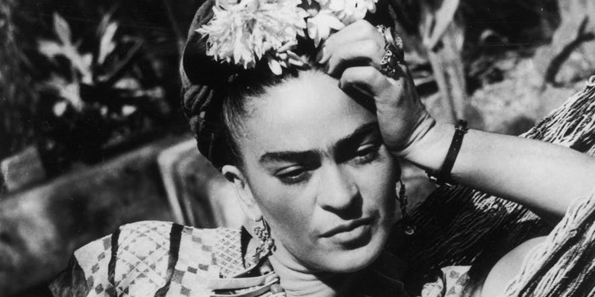 Frida Kahlo in a traditional dress, sitting in a hammock [detail]. Photo © Hulton Archive / Getty Images