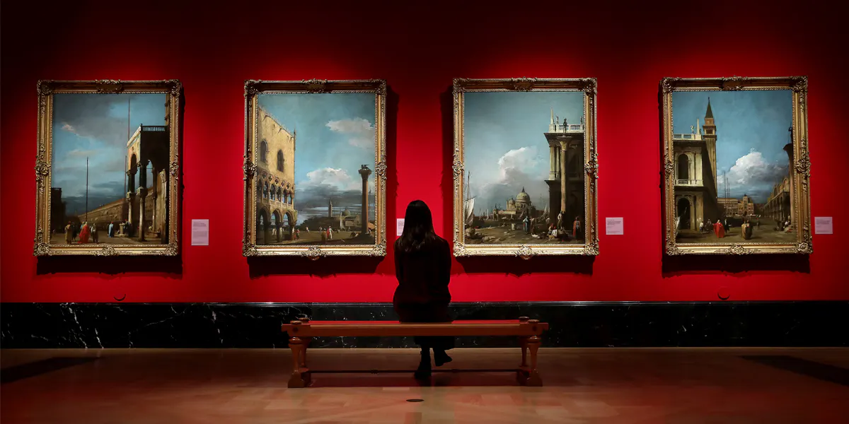 A woman looks at paintings during the ‘Masterpieces’ exhibition photocall at The Queen's Gallery, Buckingham Palace on 3 December 2020 in London, England. Photo by Chris Jackson/Getty Images