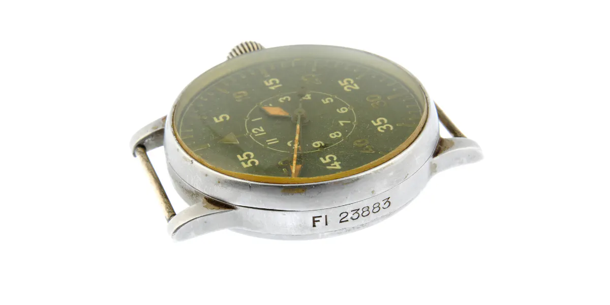 A. LANGE & SÖHNE - a WW2 German military issue pilot watch head. Circa 1942. Stainless steel case. Case numbered FL23883, 211219. Signed manual wind movement, numbered 211219. Type B black dial with inner luminous Arabic numeral hour markers, outer minute track with timing divisions at five-minute intervals. 55mm. Photo © Fellows