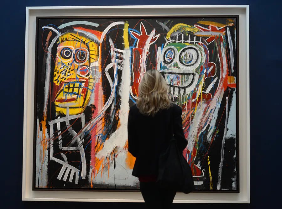 « Dustheads » de Jean-Michel Basquiat est exposé lors de l'avant-première des ventes d'art impressionniste et moderne de Christie's à New York, le 3 mai 2013. La vente d'art impressionniste et moderne de Christie's est prévue les 8 et 9 mai. Image © EMMANUEL DUNAND/AFP via Getty Images