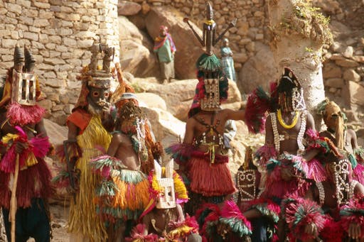 Group dance with ritual masks in Nombori, Dogon country, Mali. Photo © Vicente Méndez via Getty Images (detail)