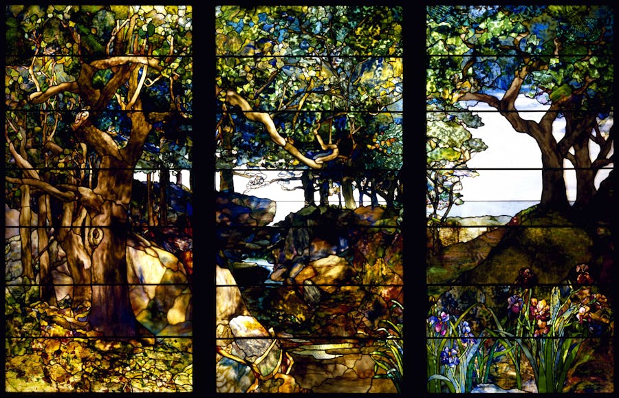 Louis Comfort Tiffany (American, 1848–1933), A Wooded Landscape in Three Panels, c. 1905, stained glass, 219.7 x 334.1 cm (86.5 x 131.6 in), Museum of Fine Arts, Houston, Texas. (Photo by VCG Wilson/Corbis via Getty Images)