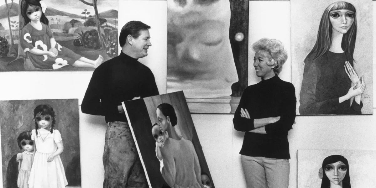 Artist Margaret Keane standing next to her painting: ‘Time in the Mind’; her husband, Walter Keane holds his painting ‘We Will Overcome’. (Photo by Bettman via Getty Images) (detail)
