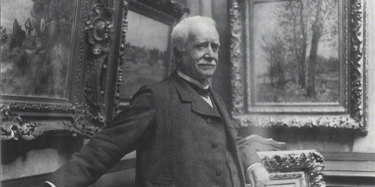 Paul Durand-Ruel nella sua galleria nel 1910. Foto di Dornac. Immagine di pubblico dominio (dettaglio)