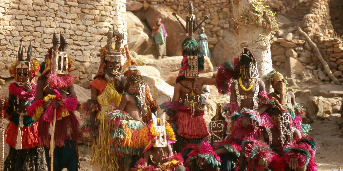 Group dance with ritual masks in Nombori, Dogon country, Mali. Photo © Vicente Méndez via Getty Images (detail)