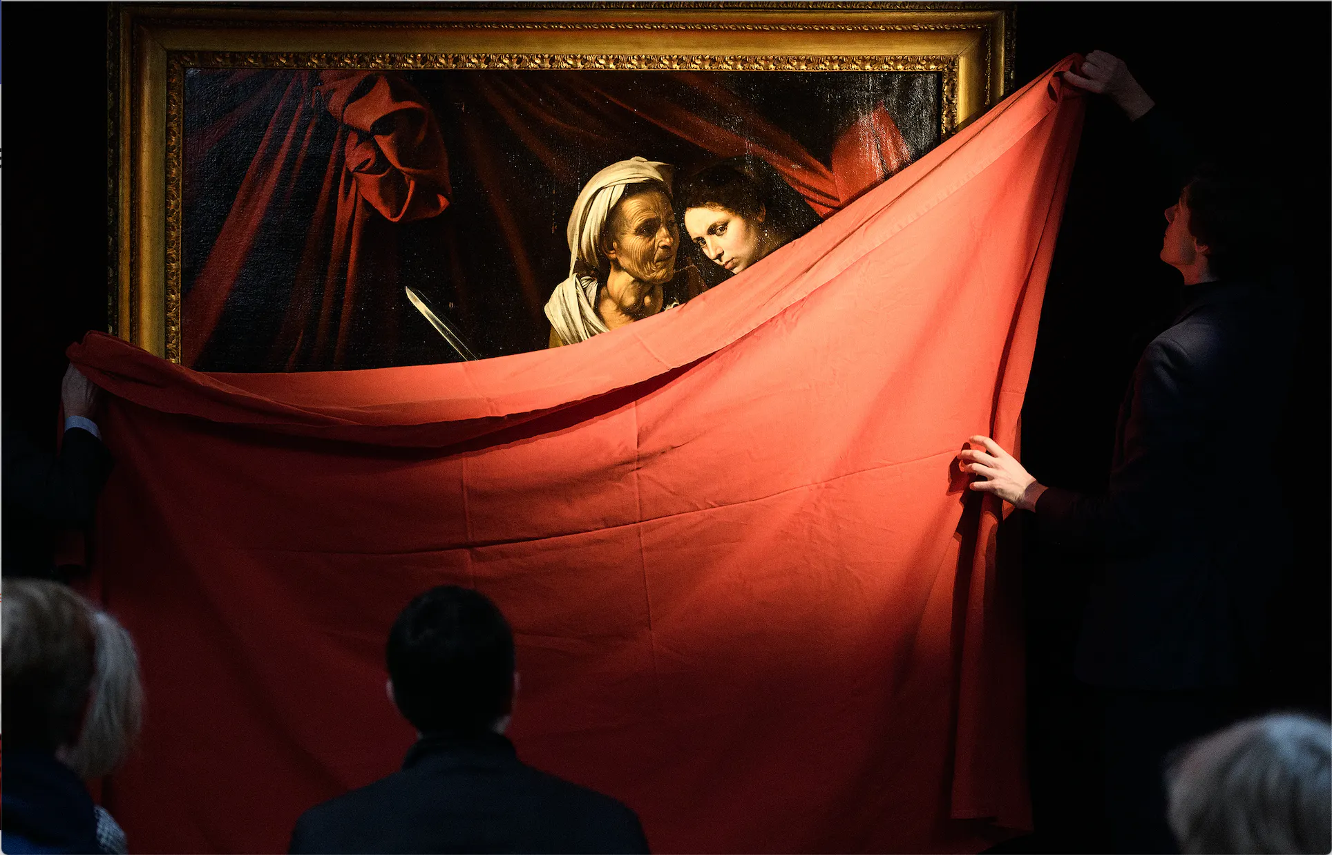 Gallery assistants reveal ‘Judith and Holofernes’ by Caravaggio during a press event to promote the upcoming sale of the work at auction, on 28 February 2019 in London, England. Photo: Leon Neal via Getty Images